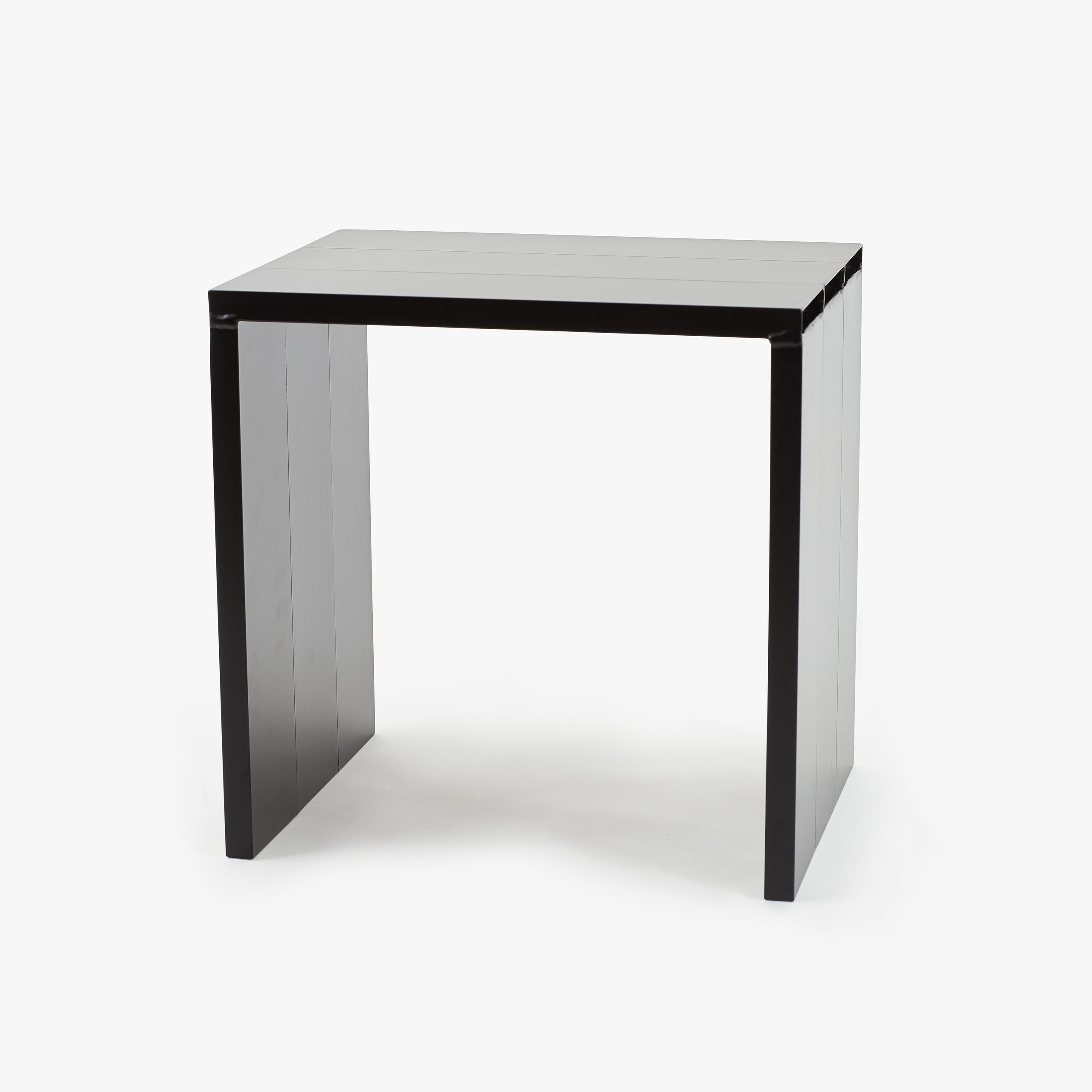 Aluminum side table by Mikel Peruch
